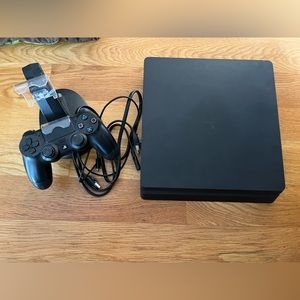 PlayStation 4 with remote and charging dock